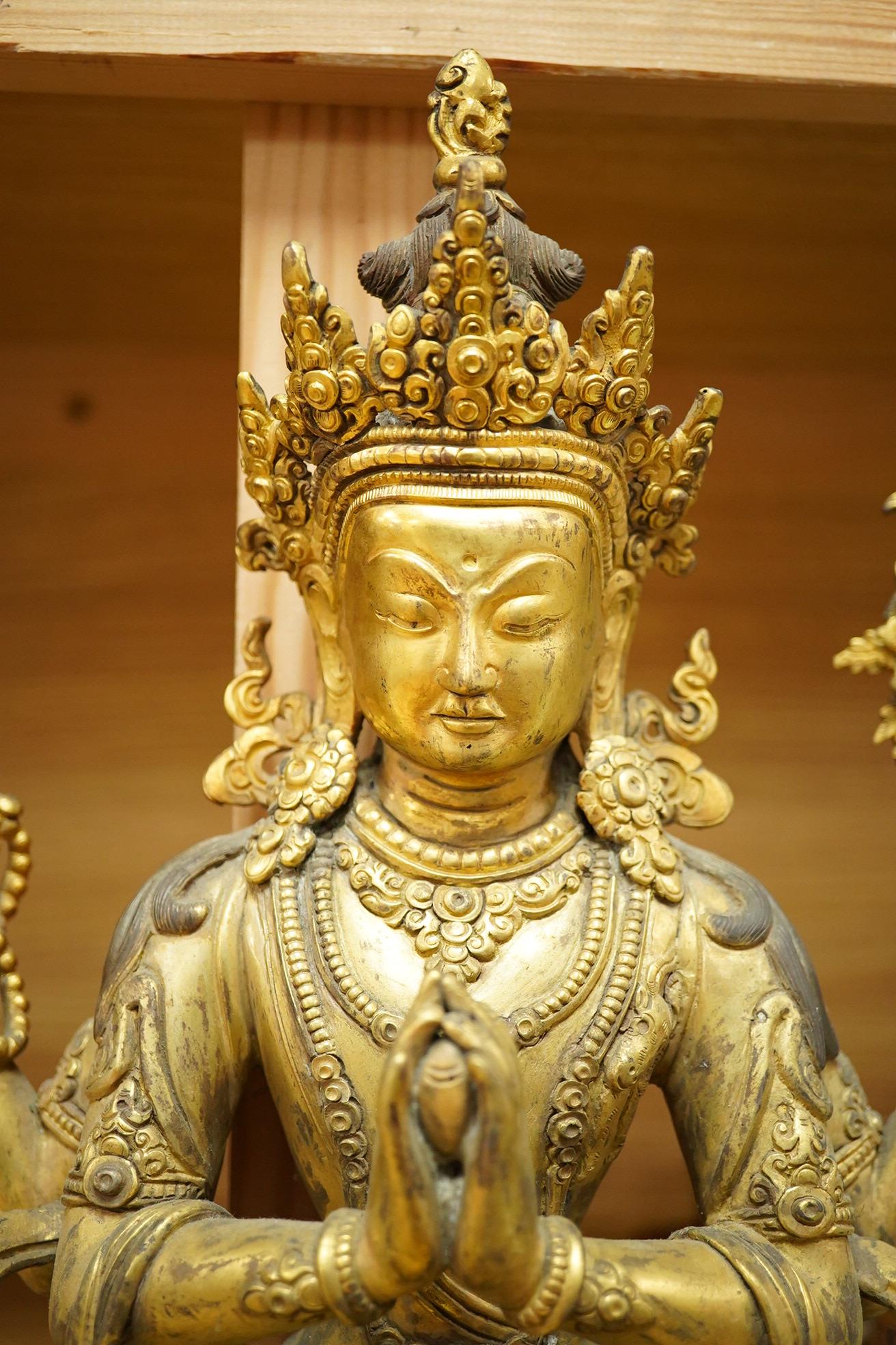 A large Sino Tibetan gilt bronze figure of Avalokiteshvara, 31cm high